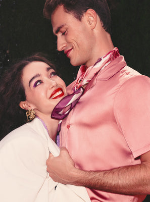 Two people embracing in a forest, very cozy